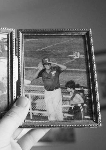 old photograph of man in baseball uniform